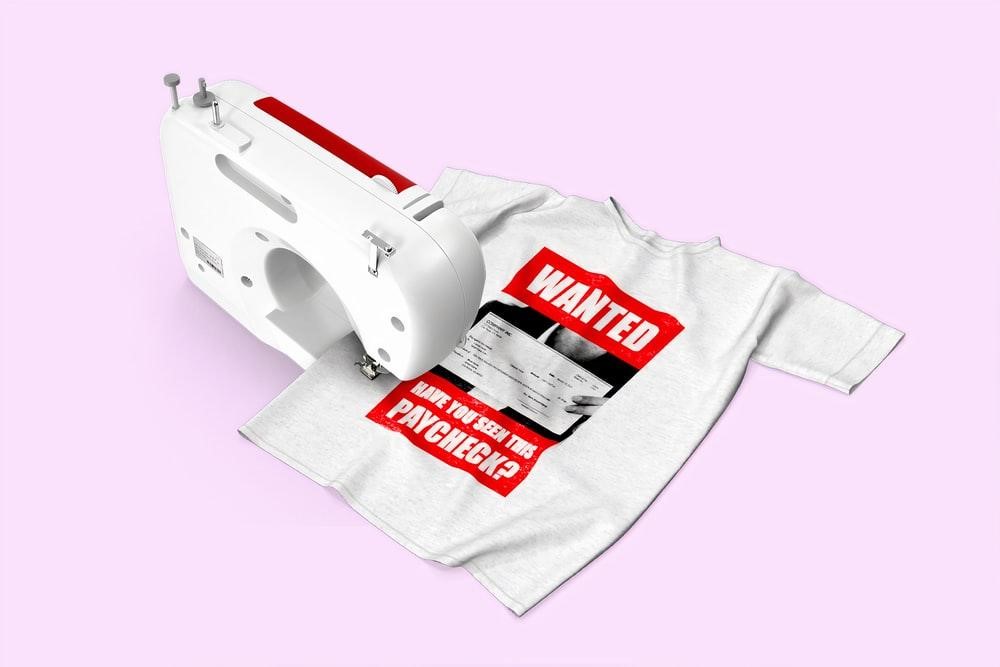 A sewing machine sewing a t shirt