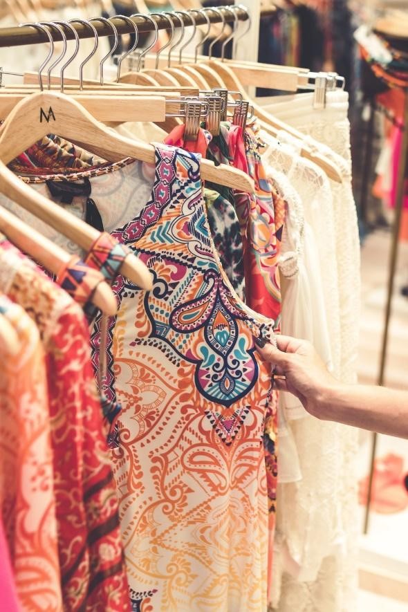 Women browsing a clothing rack.