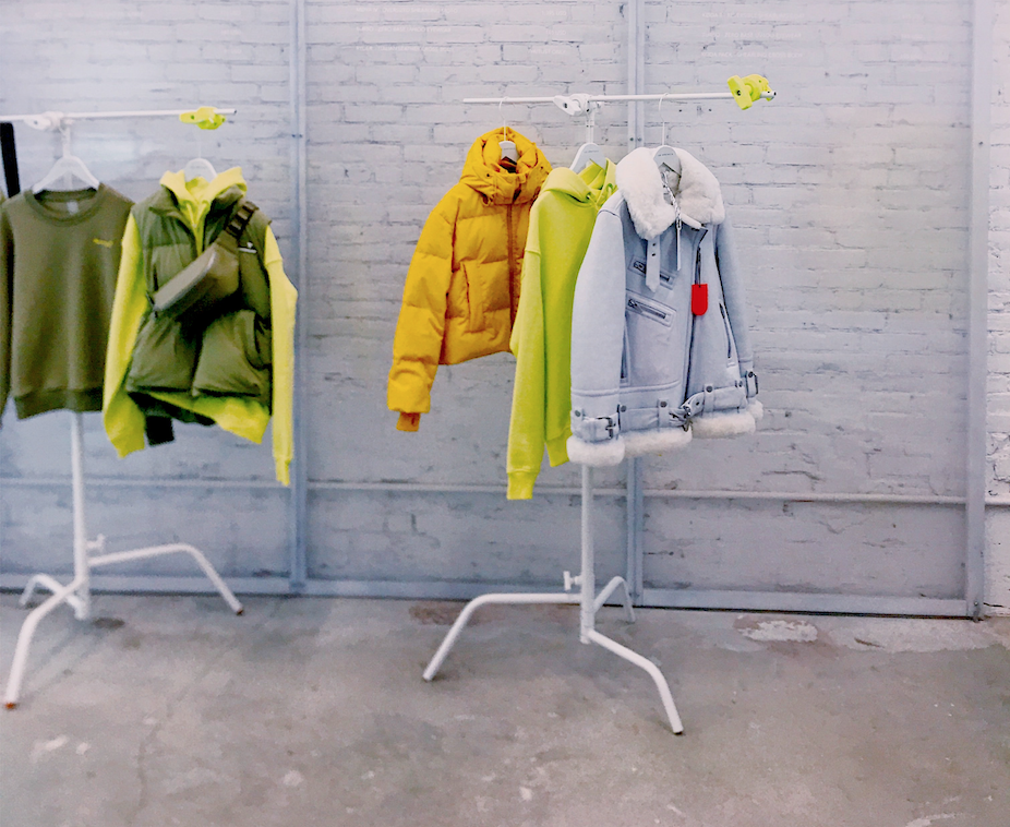 Clothing on white clothing racks