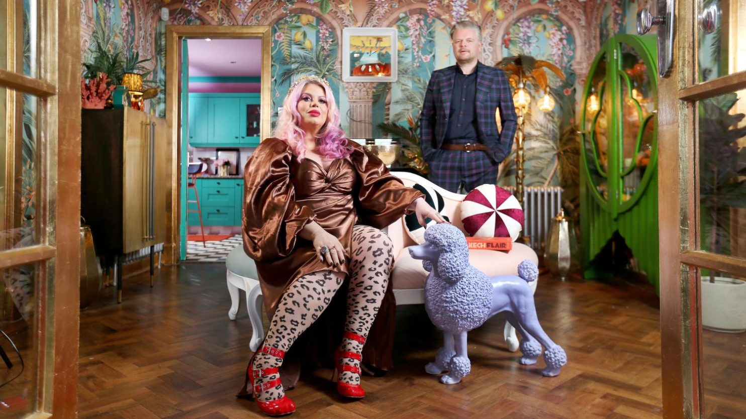 Image of a man and women in their colorful home