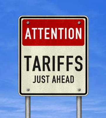 Tariff warning sign that says "Attention tariffs just ahead"