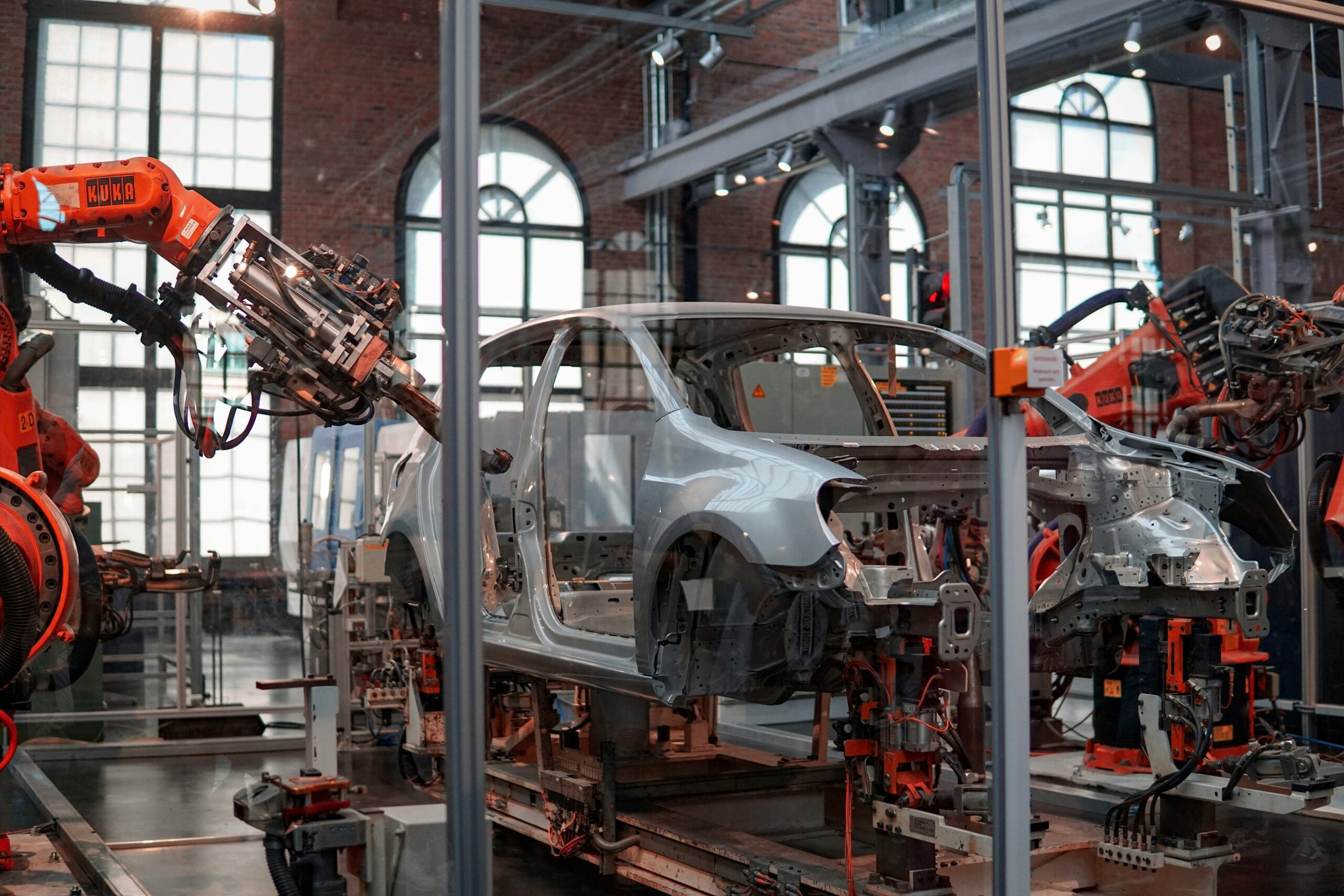 in a factory of robots making cars